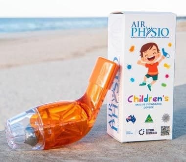 Orange AirPhysio for Children device in front of its blue and white children's mucus clearance device box