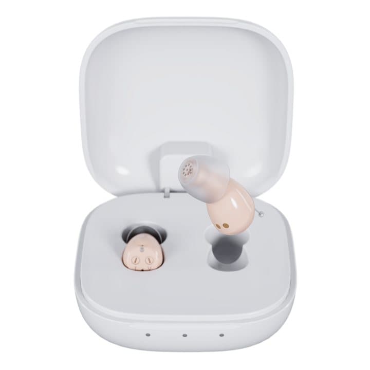 Two Audien Atom One hearing aids sitting in an open white charging case