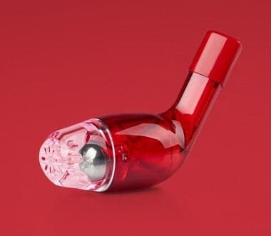 Red Better Breathing Sport device lying on its side against a red background