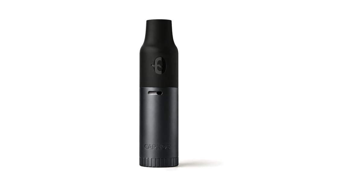 Black aluminium Capnos Legura nicotine-free inhaler standing upright on a white background