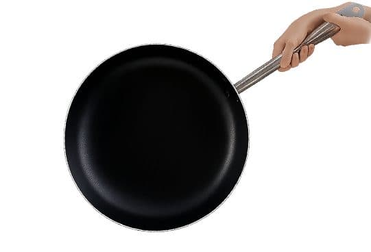 Overhead view of the black non-stick Chiefs Pan with a stainless steel handle held at the end