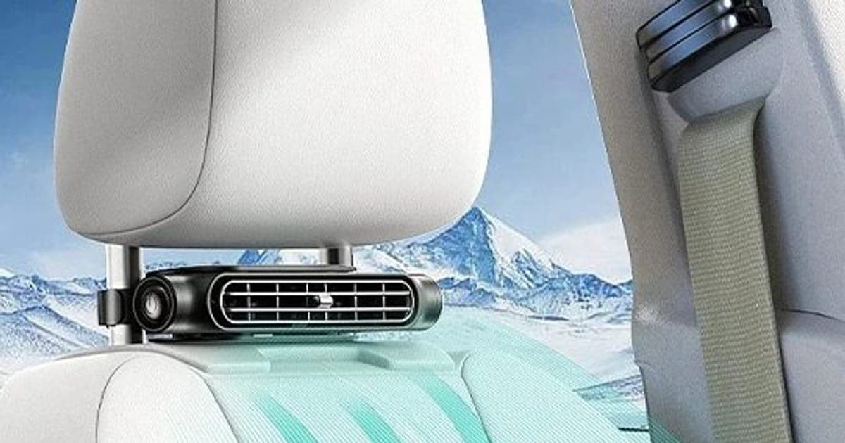 Black CoolSeat Pro fan clamped to a car headrest's posts, with green arrows showing air flowing down a light grey seat back