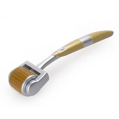 DXRoller with a curved gold and silver handle and a cylindrical roller head covered in fine gold needles