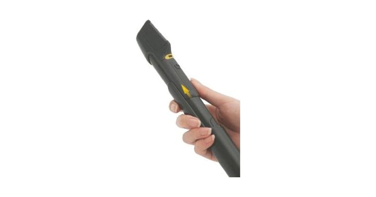Hand holding a long grey EasyTrim Pro trimmer with an angled flat head and a yellow arrow on the grip