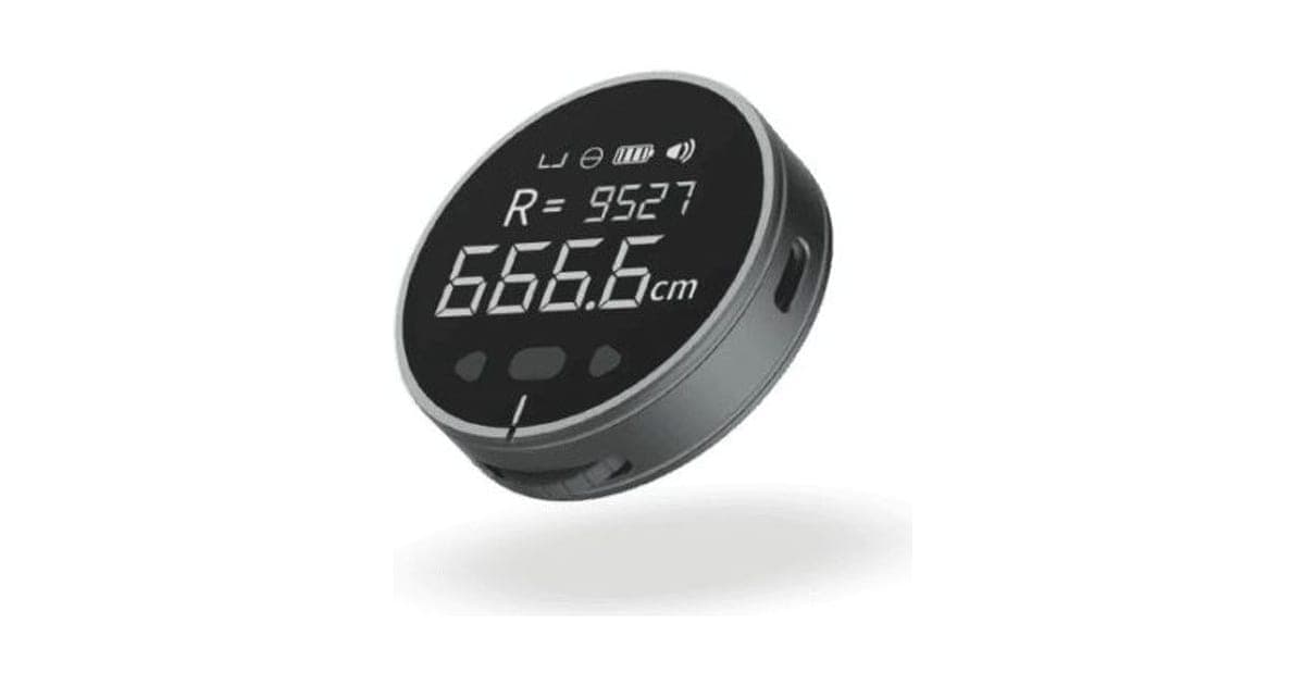 Round grey ElectronX Ruler with a black display showing R = 9527 and 666.6 cm, with battery and sound icons
