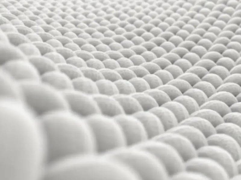 Close-up of the textured weave of the FluffCo pillow's white cotton cover