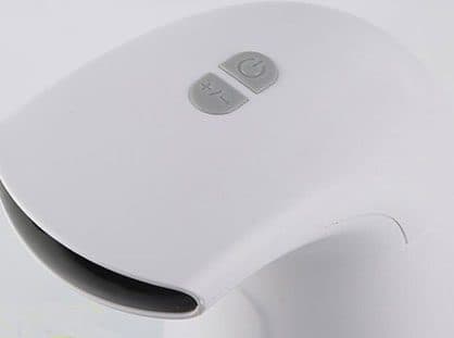 Close-up of the Foamatic top with a power button and a plus-minus foam level button above the sensor