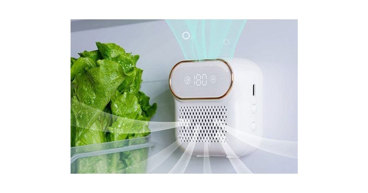 White FridgeSan Pro unit with a rose-gold rimmed display reading 180 inside a fridge beside lettuce, with green air streams marked O3