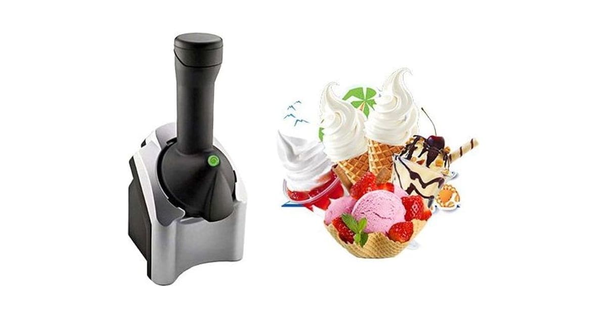 Silver and black FrostyJoy frozen fruit dessert maker with a tall black chute, beside cones and cups of soft-serve, strawberry ice cream and fruit