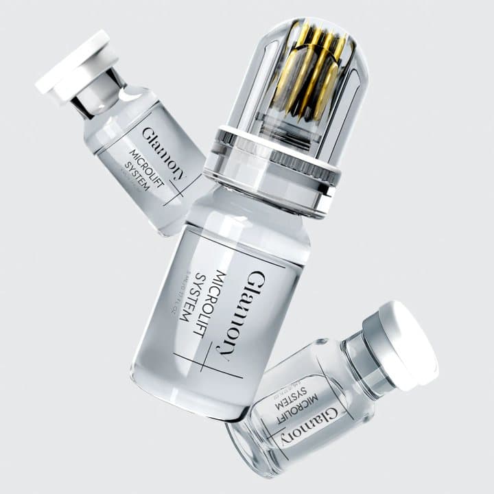 Glamory MicroLift serum vials, one with a gold-needled microneedle head attached