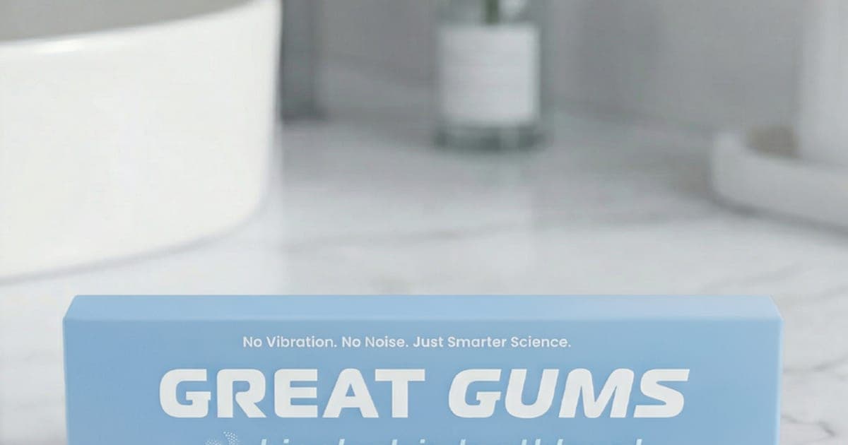 White Great Gums bioelectric toothbrush in front of its light blue box on a marble counter
