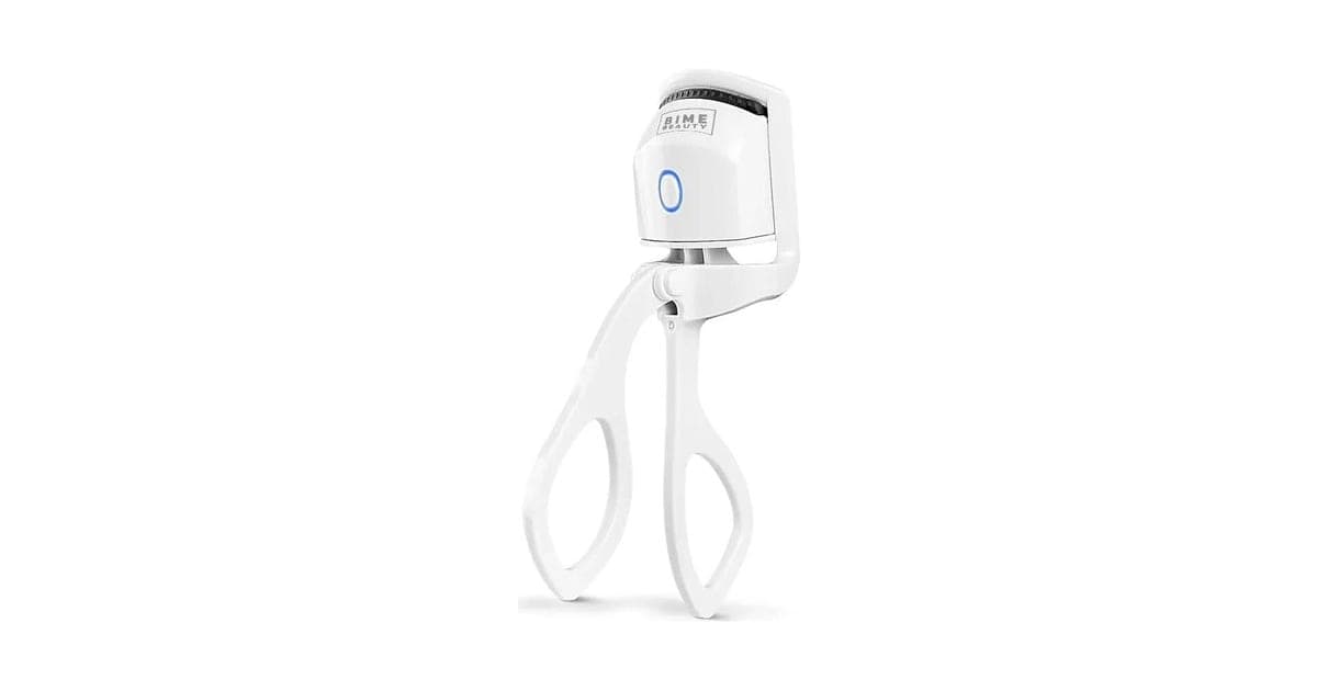 White Bime Beauty heated eyelash curler with scissor handles and a curved heated head with a blue power button