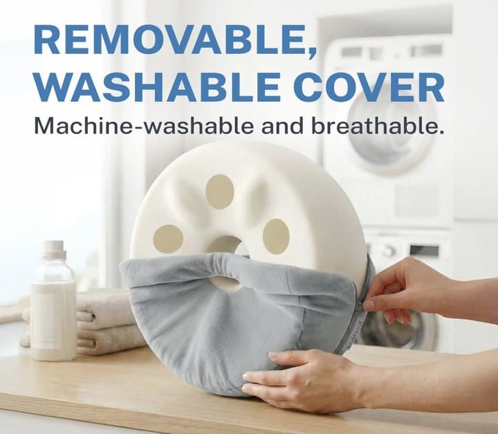 Hands removing the grey knēNest cover from the white foam core in a laundry room