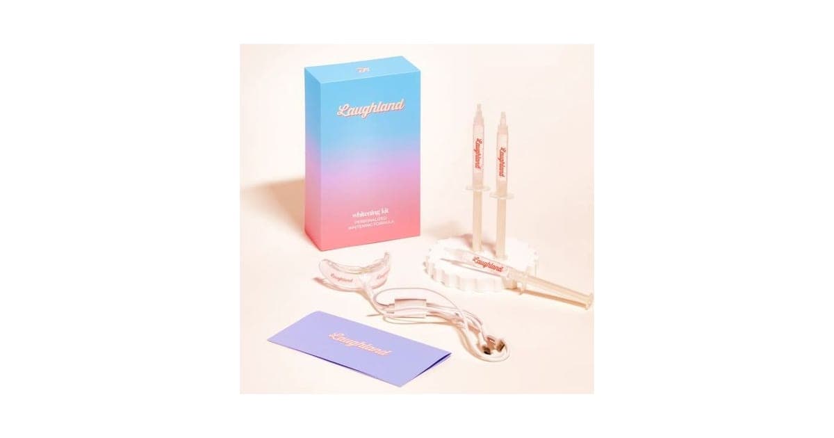 Laughland whitening kit box with two gel syringes, the LED mouthpiece with cable and an instruction booklet