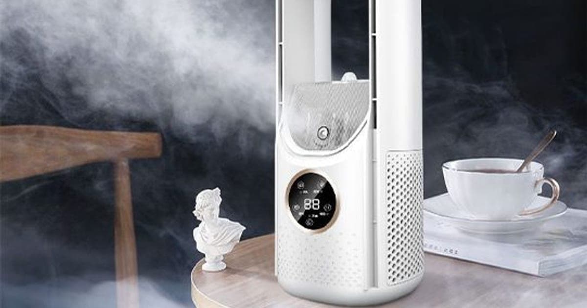 White LeaflessCool Air bladeless fan with a tall U-shaped loop, a clear mist tank and a round touch display, misting beside a wooden chair and a teacup