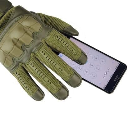 Hand in an olive MasterGloves glove pressing numbers on a smartphone screen with a gloved fingertip