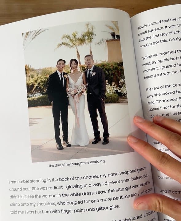Open Memorygram book showing a wedding photo and a page of printed story text