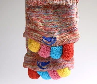 Close-up of the colourful fabric toe spacers on a pair of My Happy Feet Socks