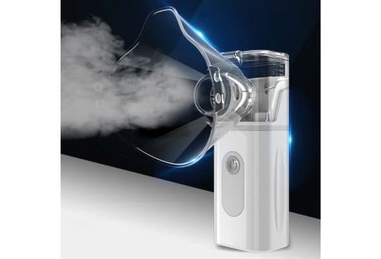White MyNebulizer with a clear medicine chamber and an adult face mask, producing a thick white mist