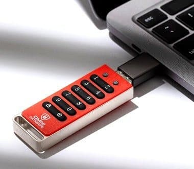 Omni DataSafe encrypted USB drive plugged into the side of a laptop