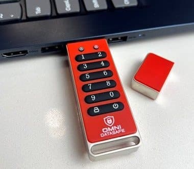 Omni DataSafe drive lying on a desk next to its red protective cap