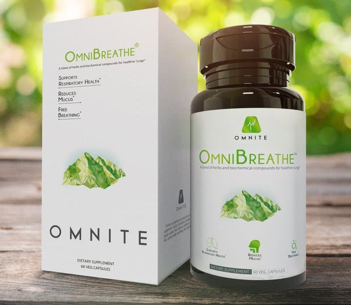 OmniBreathe bottle by Omnite next to its retail box on a wooden table