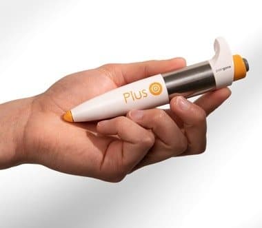Hand holding the Paingone Plus pen with thumb on the button