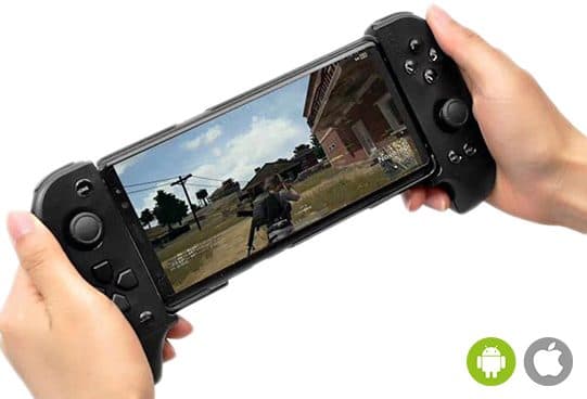 Hands holding the black PlayX Pro stretched around a phone, with analog sticks and buttons on each grip and a battle royale game on screen