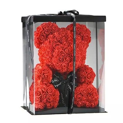 Red rose bear inside a tall clear plastic gift box with a black lid and base, tied with a black Happy everyday ribbon