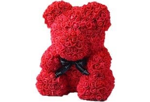 Red Roseal CuteBear made of densely packed small foam roses, sitting with a black ribbon tied at its neck