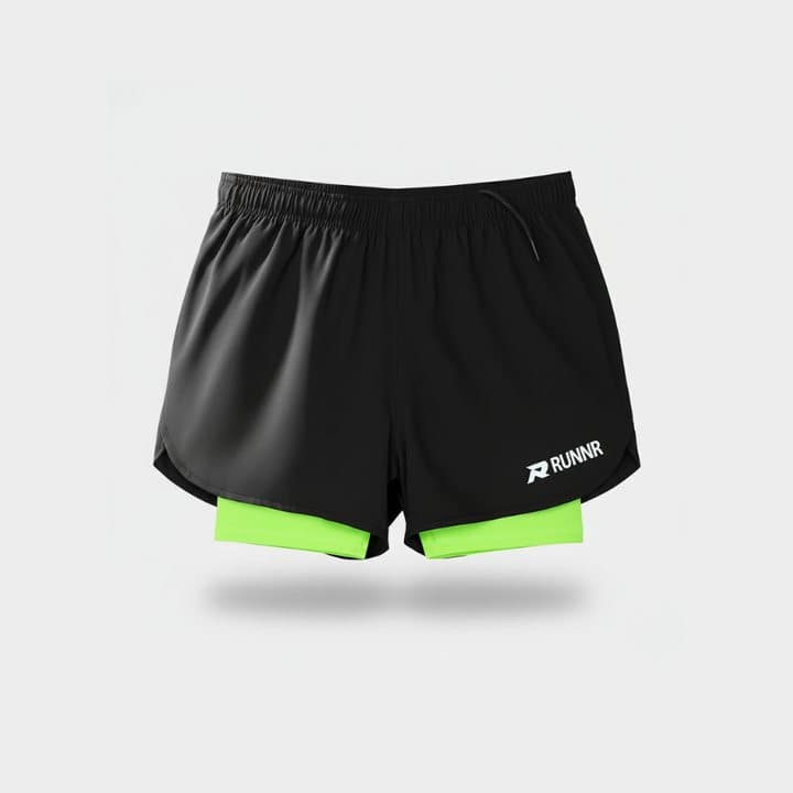 Black RUNNR 2-in-1 running shorts with a lime green compression liner on a white background