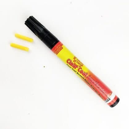 ScratchUndo Pro pen labelled Clear Coat Applicator with two yellow spare felt tips on a white surface