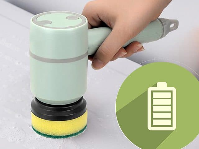 ScrubClean Pro with a sponge head on a wet white surface beside a green full-battery icon