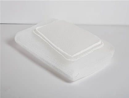 White mesh SenseSleep pillow with a thinner rectangular mesh layer laid on top, showing the height adjustment layers