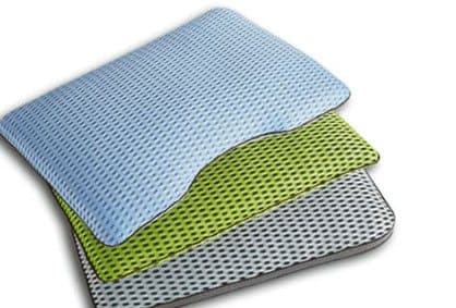 Three stacked mesh pillowcases in blue, green and grey offered as the SenseSleep breathable Japanese pillow case add-on