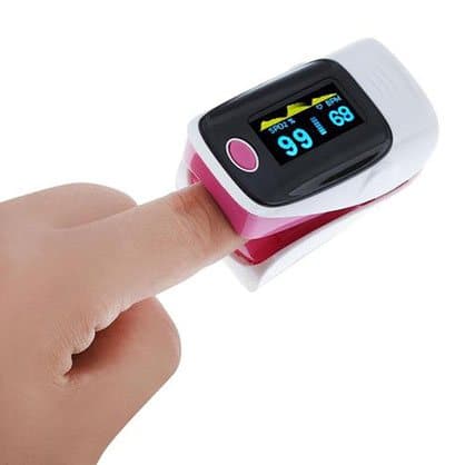 Pink fingertip pulse oximeter clipped on a finger showing 99 and 69, sold as the Smart Fitness Analysor add-on