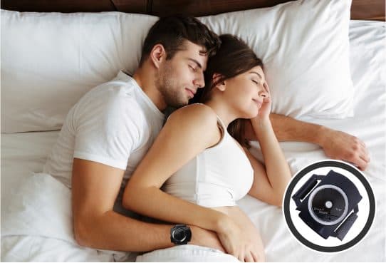 Man and woman asleep in bed, his arm around her wearing a black wristband, and a circular inset of the SnoreRem Plus device