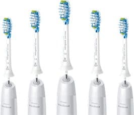 Five white replacement toothbrush heads with blue and green bristles that appear to be Philips Sonicare heads