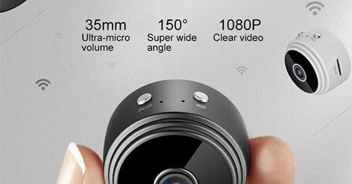 Black SpyRec Pro mini camera with on/off and mode buttons held between two fingers, labelled 35 mm, 150 degree super wide angle and 1080p clear video