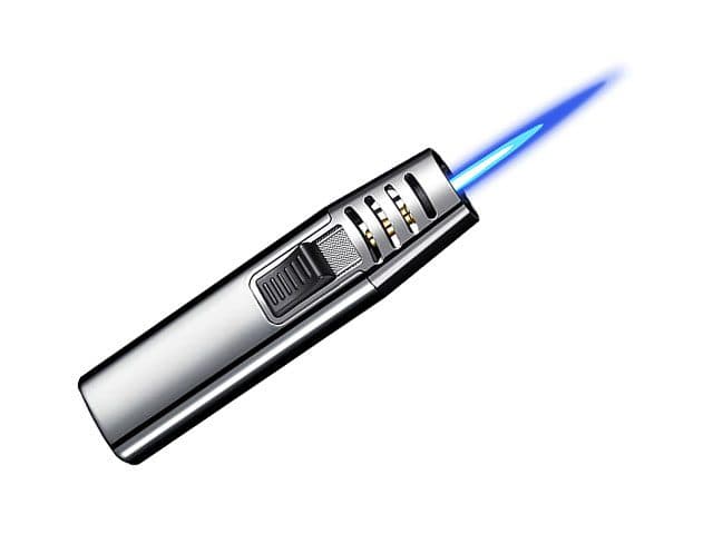 Silver StormFlame Pro with a side slider and vented head producing a long blue jet flame