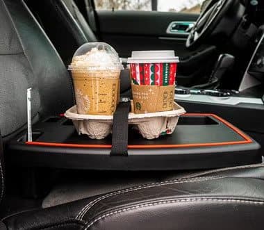 Stupid Car Tray on a passenger seat holding two iced coffees in a cup carrier