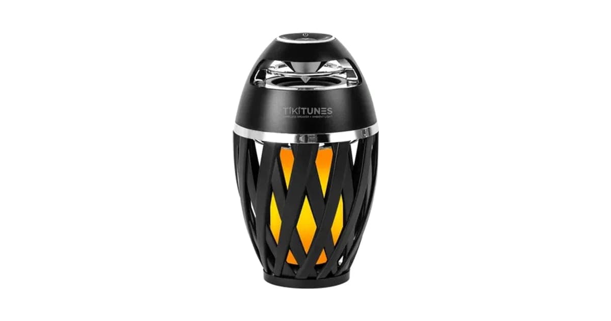 TikiTunes speaker with a black top, silver band and glowing orange flame pattern on a white background