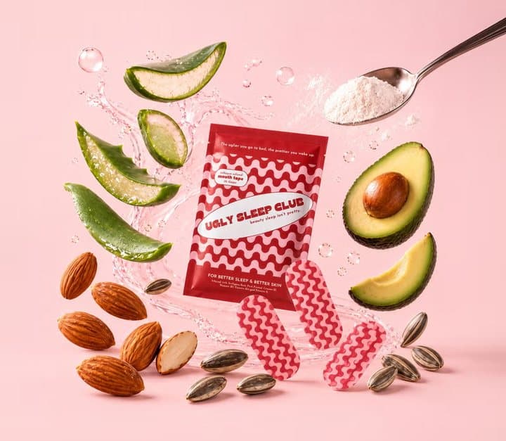 Ugly Sleep Club pack surrounded by aloe, almonds, avocado and seeds with a spoon of powder
