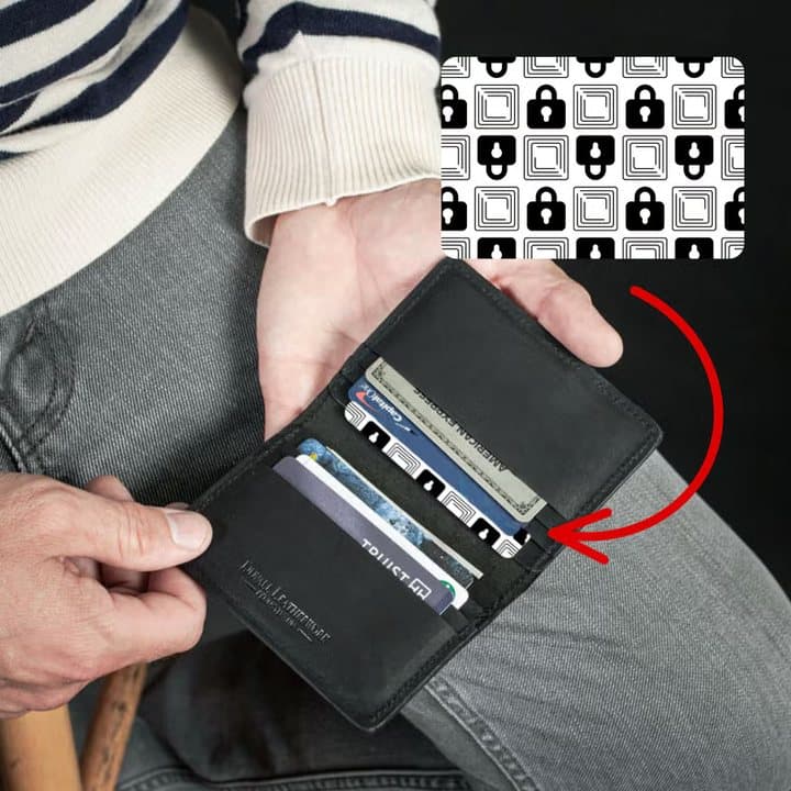 Open black bifold wallet with an arrow showing where to place the Wallet Defender card