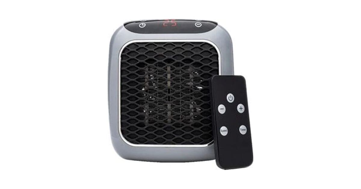 Grey WarmAIR Pro wall-plug heater with a black honeycomb grille and a red digital display reading 25, beside a black remote with power, plus, minus, speed and time buttons