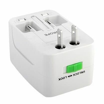 White universal travel plug adapter with folding US pins and a green lock slider