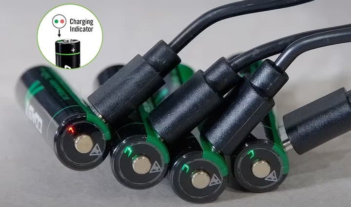 Four Zithion-X batteries charging with cables plugged into their tops and indicator lights glowing