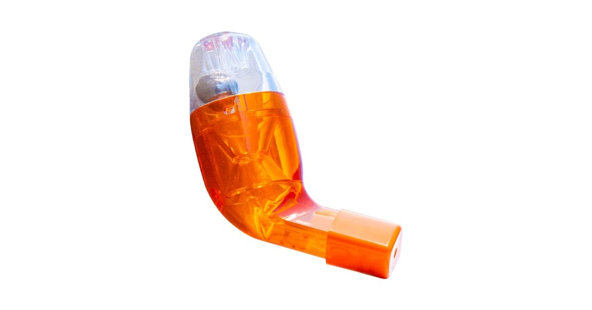 Orange AirPhysio for Children mucus clearance device with a clear cap showing the steel ball inside