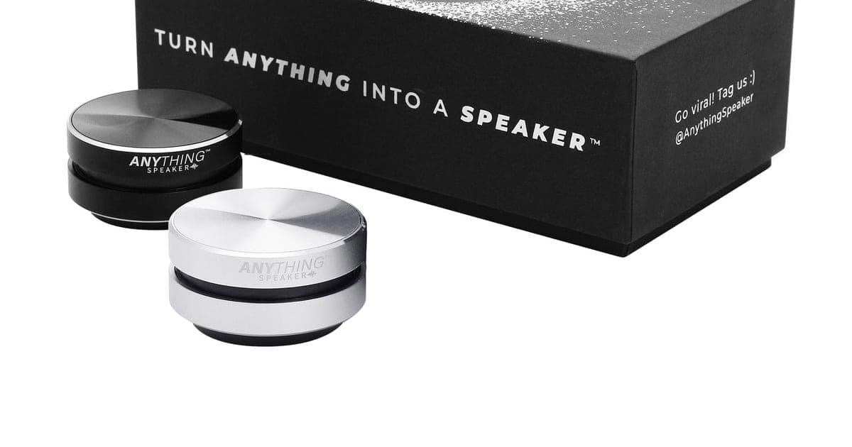 Black and silver Anything Speaker units in front of a black box reading turn anything into a speaker