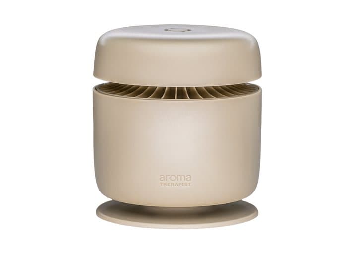 Beige Aroma Amplifier fan diffuser with its raised lid showing the air vents